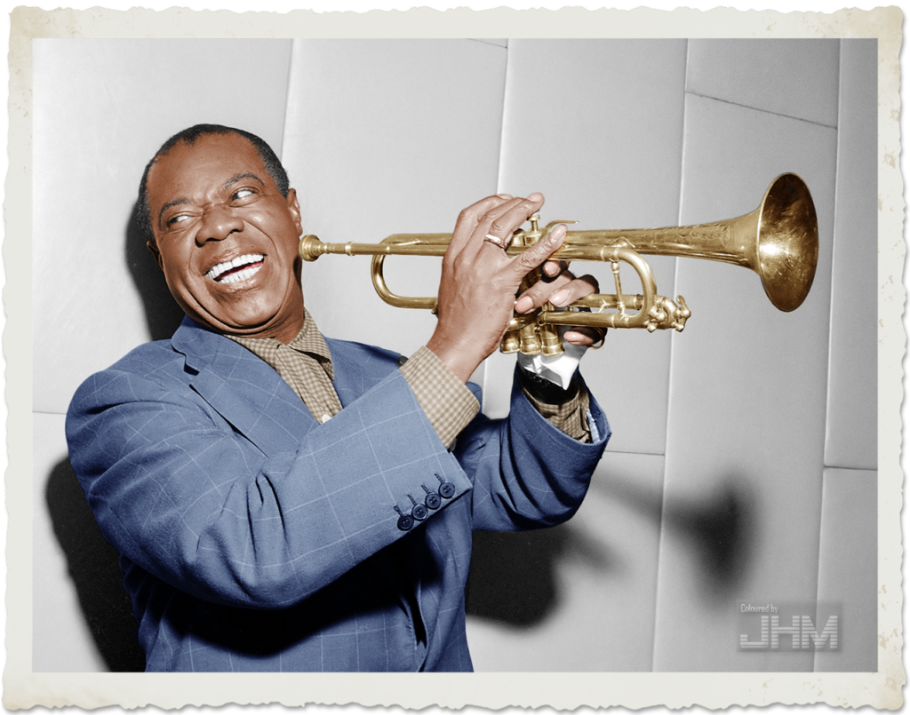 A man in a blue suit smiles widely while holding a trumpet, embodying the energy of the motivational quote, "I AM somebody.