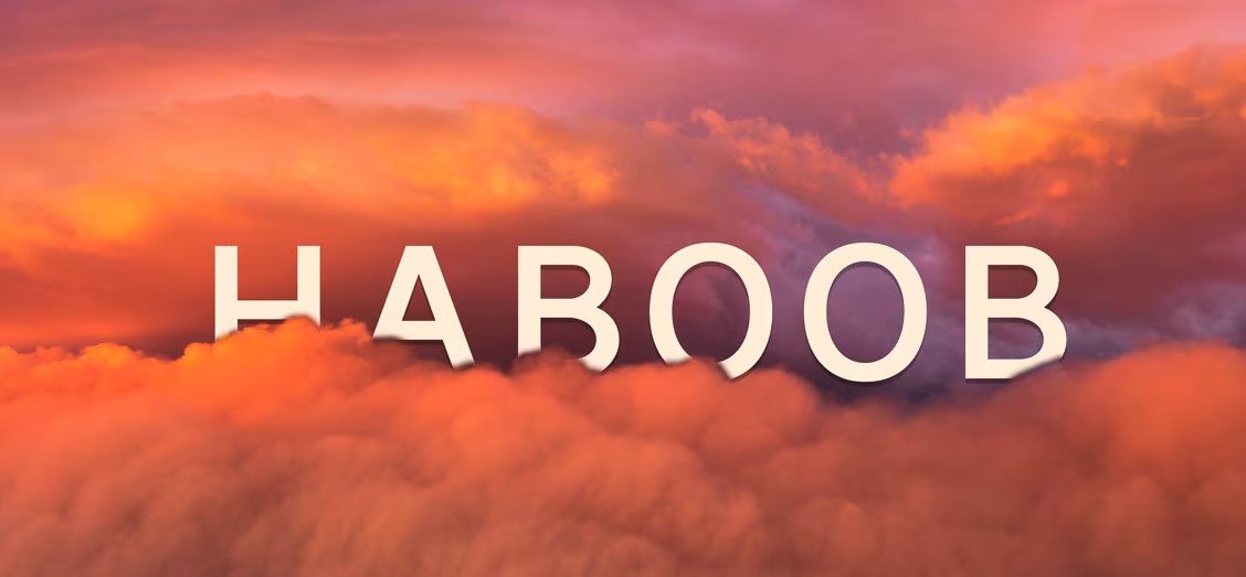 A vibrant scene where the word "HABOOB" is displayed over an image of an orange and pink cloud-filled sky, as if the day has been swallowed by a mesmerizing sunset or sunrise.