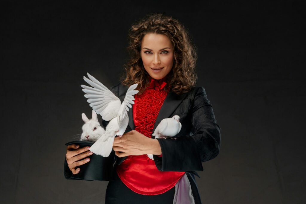 Enchanting magician with white doves