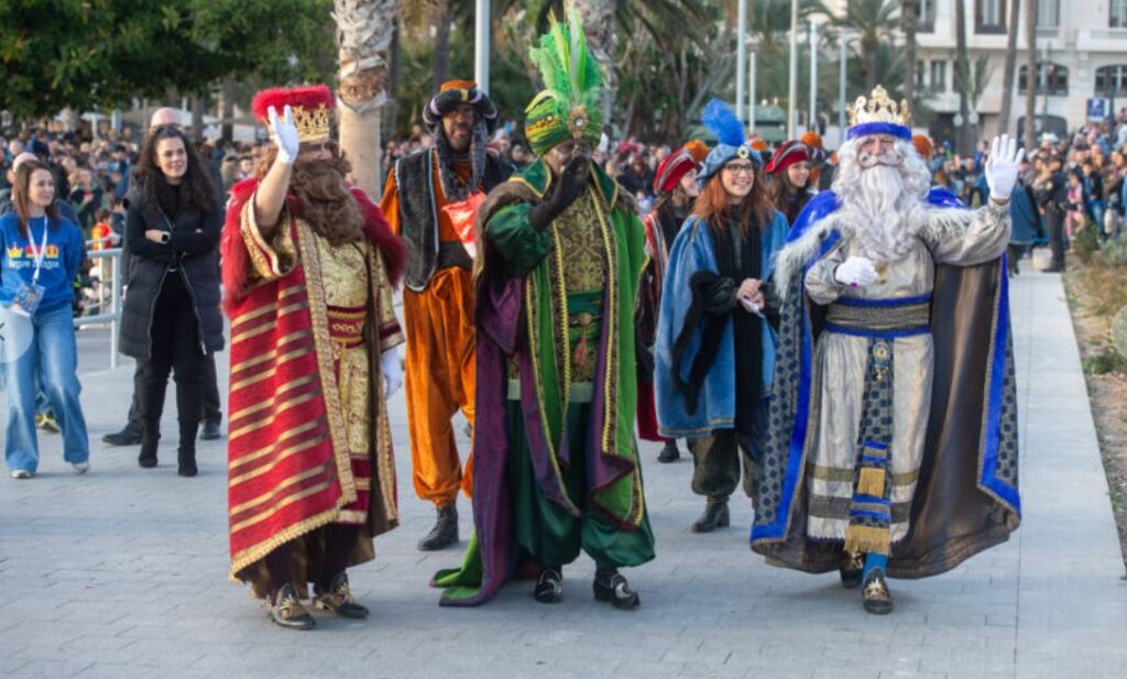 A vibrant group in colorful regal costumes parades down the street, captivating the crowd gathered to watch. This spectacle, which started as a joyous tradition in Alcoy, fills the air with festive energy and excitement.
