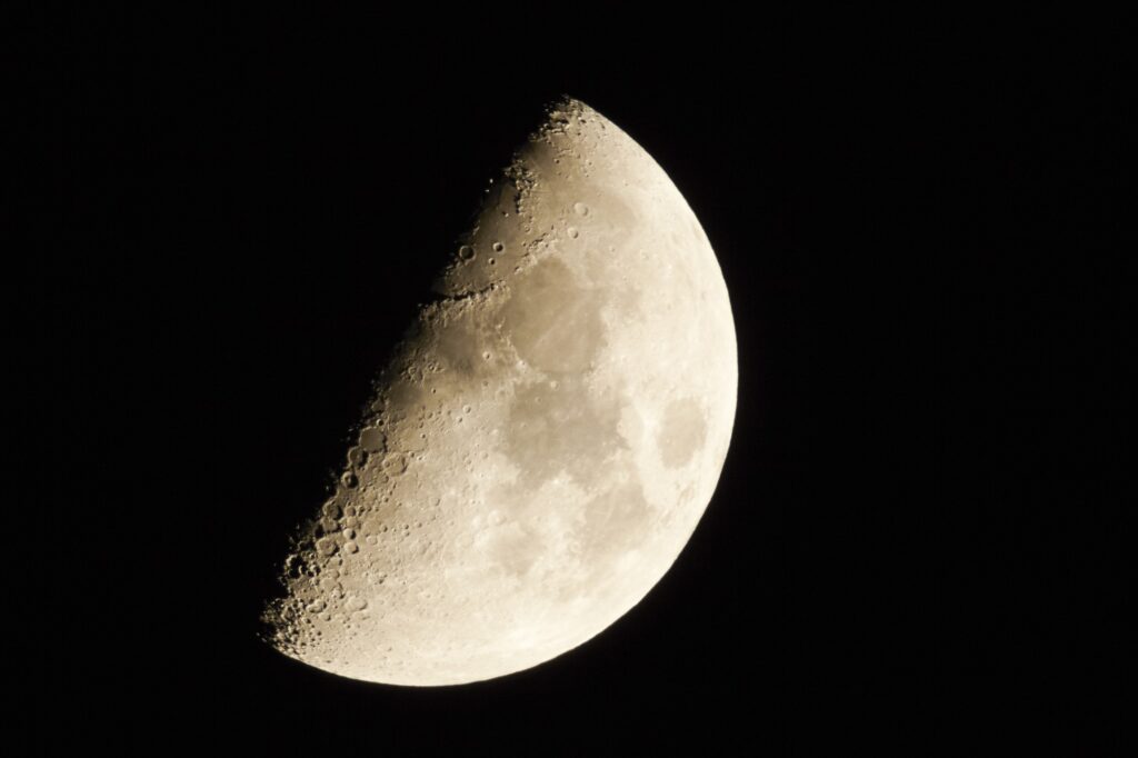 Half moon in a clear sky at night.